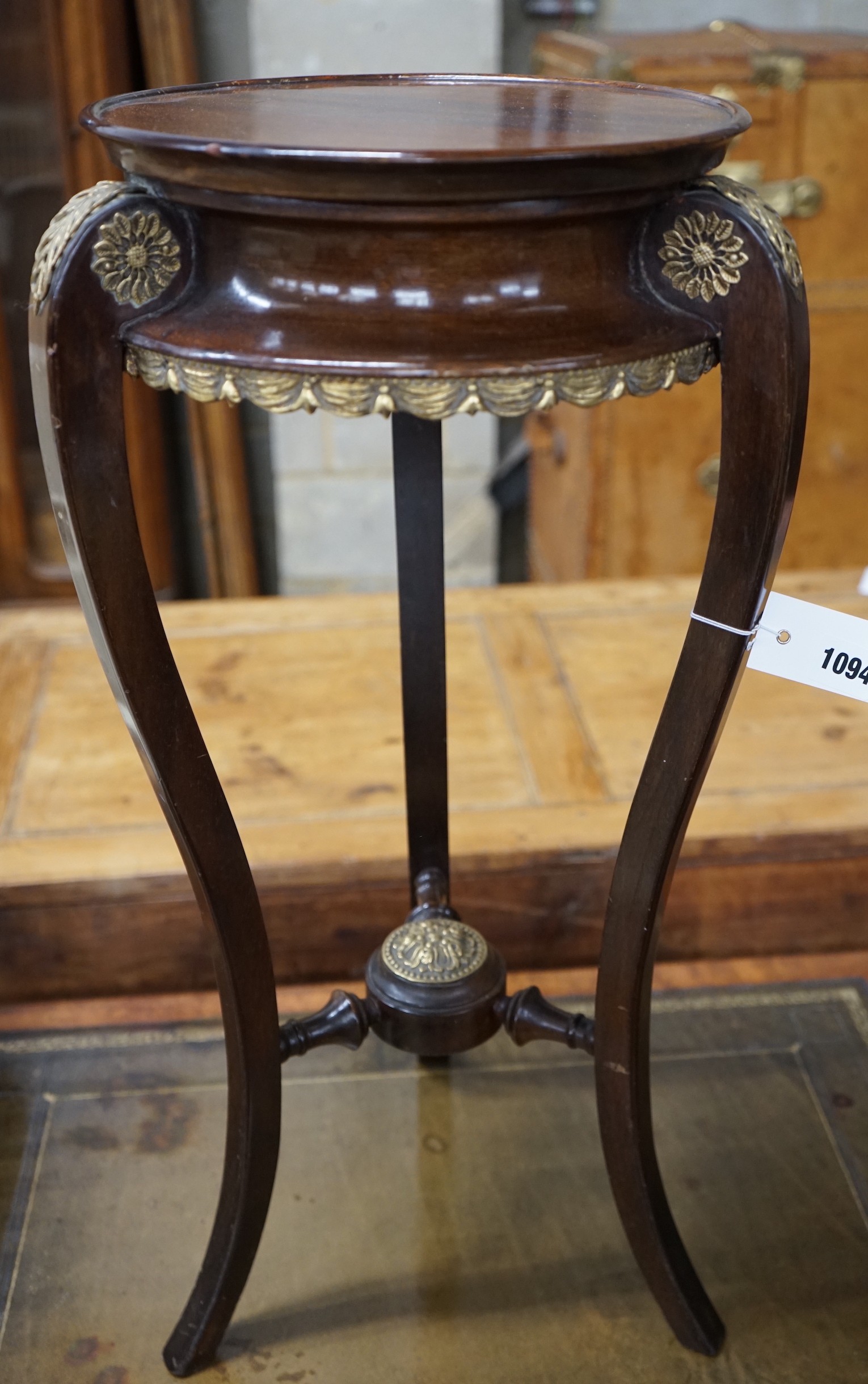 A French gilt metal mounted mahogany Empire style vase stand, height 67cm and an Arts and Crafts brass bound staved mahogany circular jardiniere, diameter 35cm, height 78cm